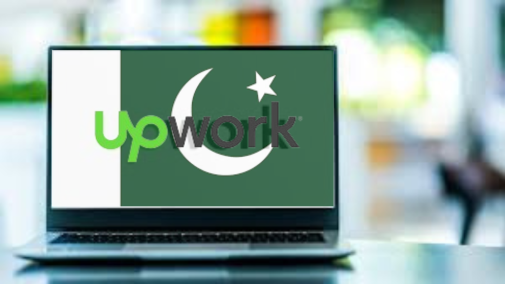 Laptop screen displaying the Upwork homepage with the Pakistani flag in the background.